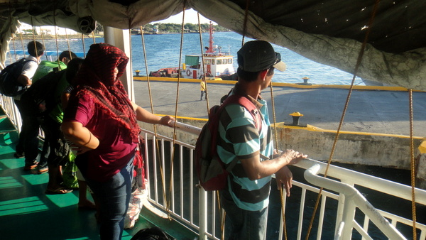 Passengers on the ferry waiting to dock