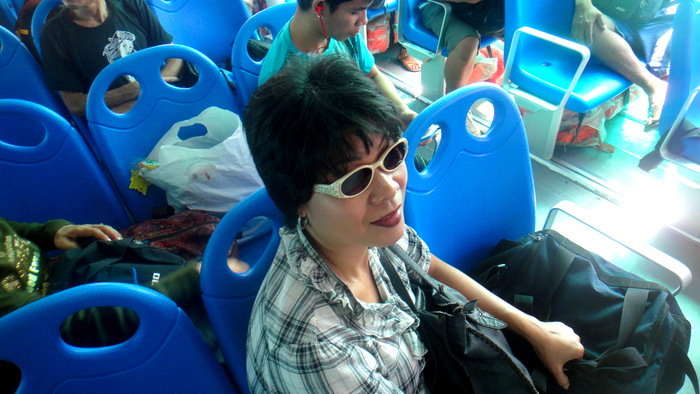 my asawa sitting in the economy section of the supercat ferry