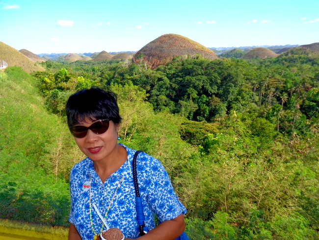my wife poses by chocolate hills bohol