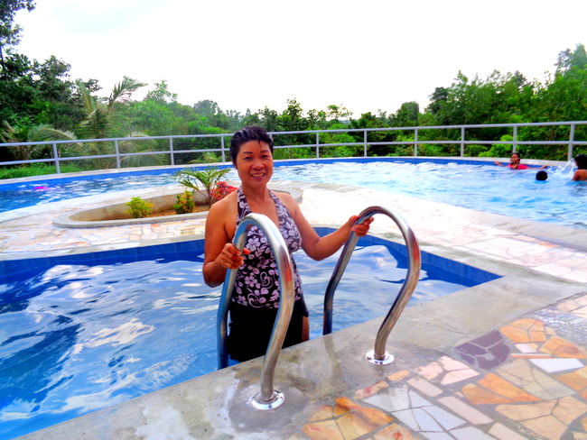 my lovely filipina wife exits our new swimmin pool in the philippines