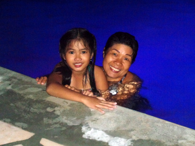our niece and her auntie in our new swimming pool in the philippines